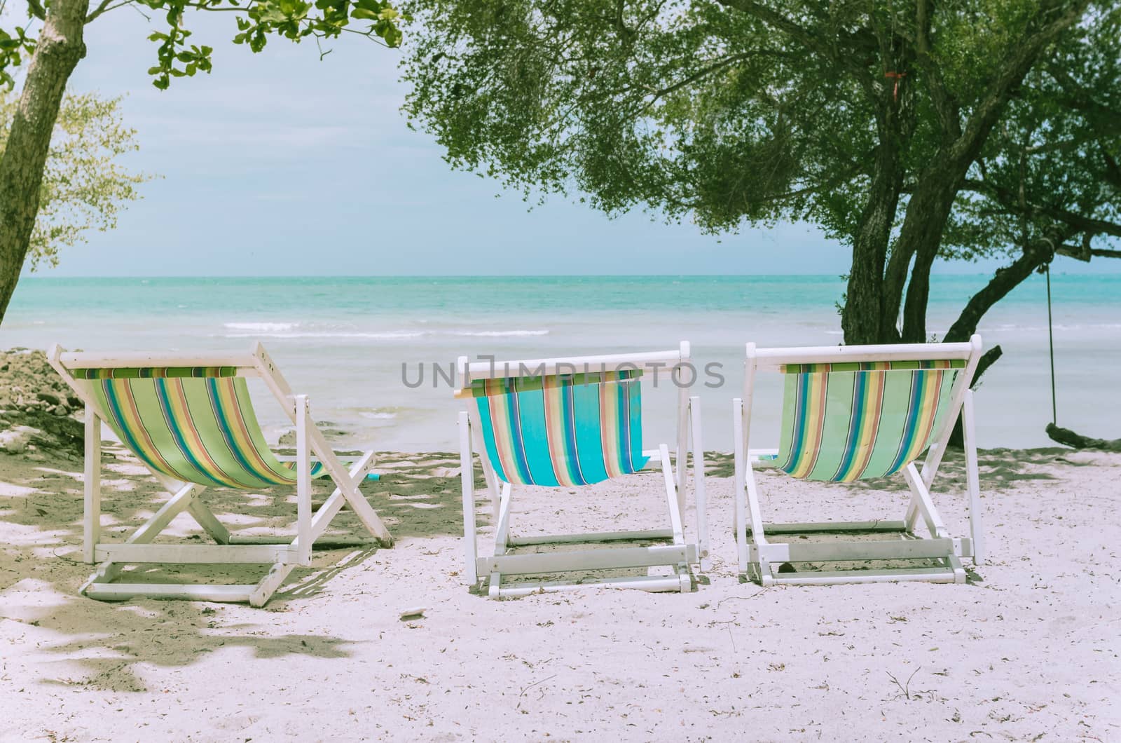 Beach colorful chair on the beach in Koh Samet Thailand vintage