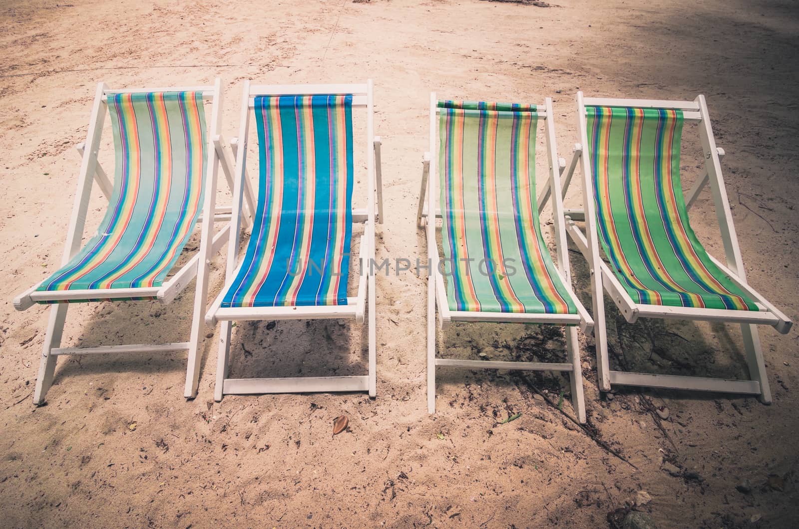 Beach colorful chair on the beach in Koh Samet Thailand vintage