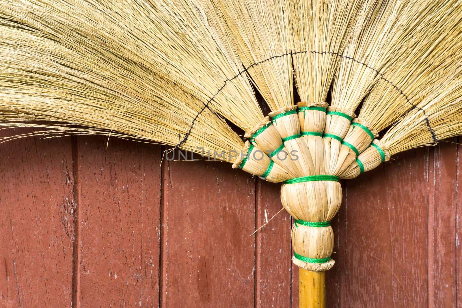 Broom Stick Lay on a Brown Wooden Door