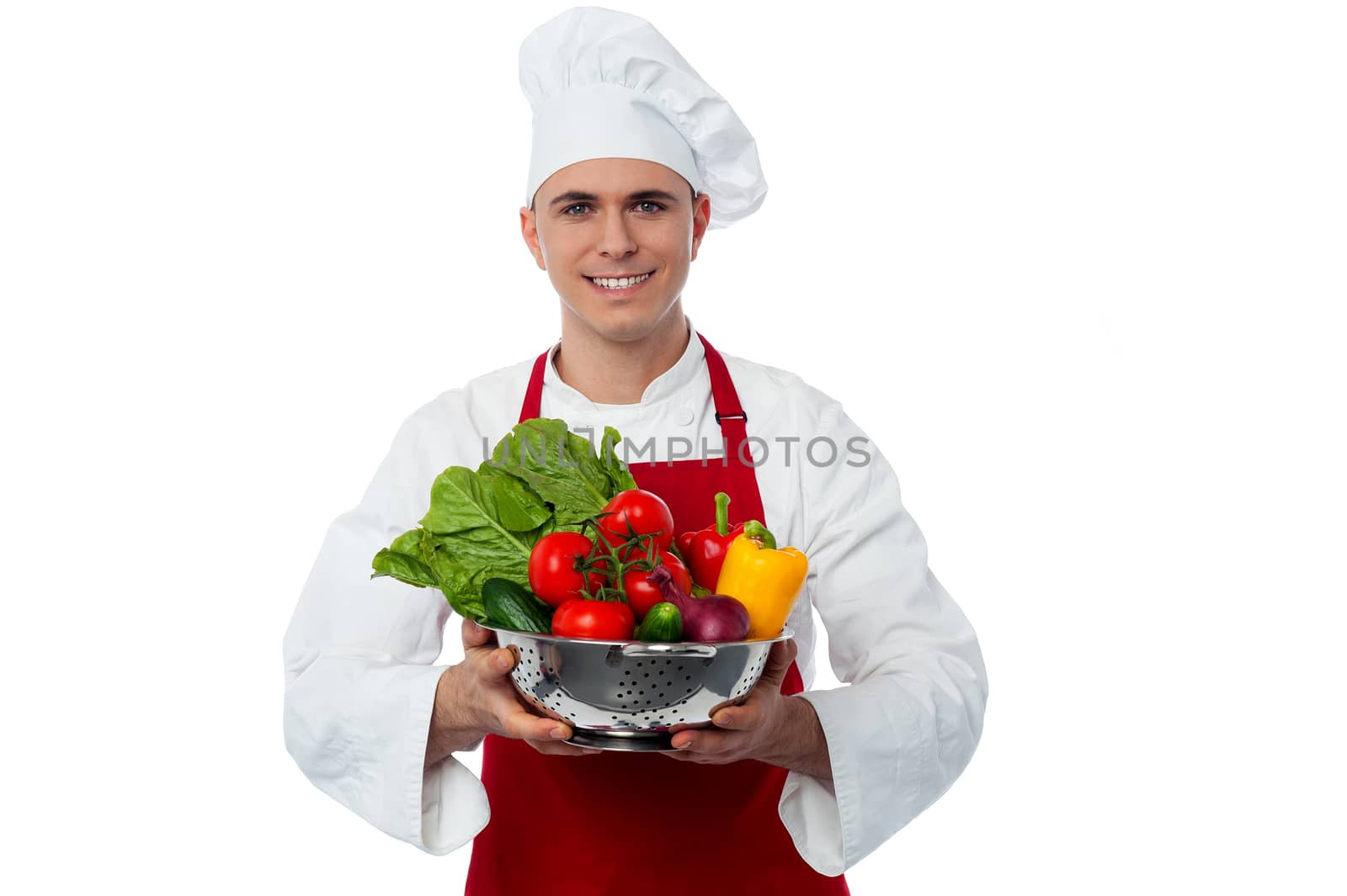 Image of a chef holding vegetables bowl