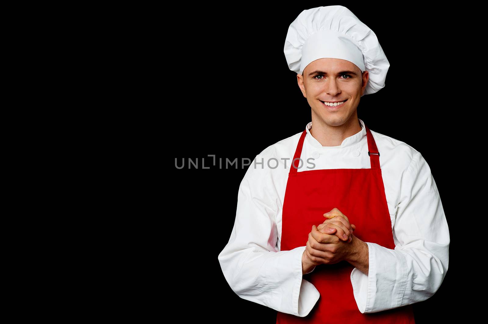 Portrait of a handsome chef by stockyimages
