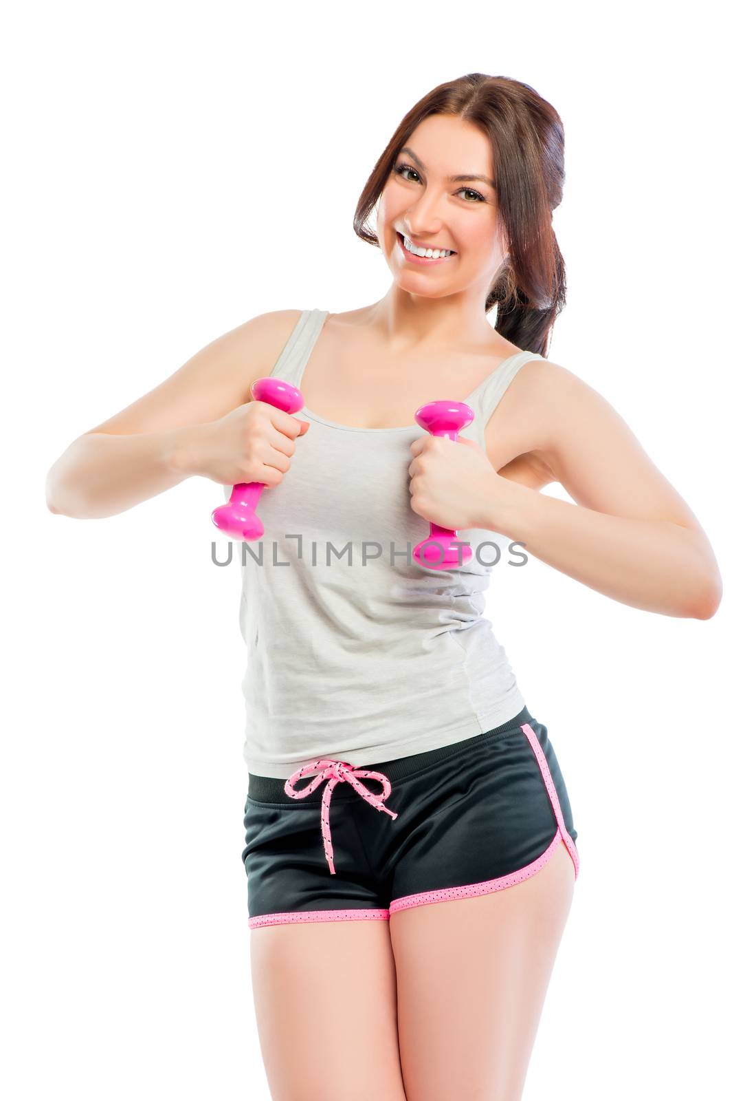 smiling girl with dumbbells in studio