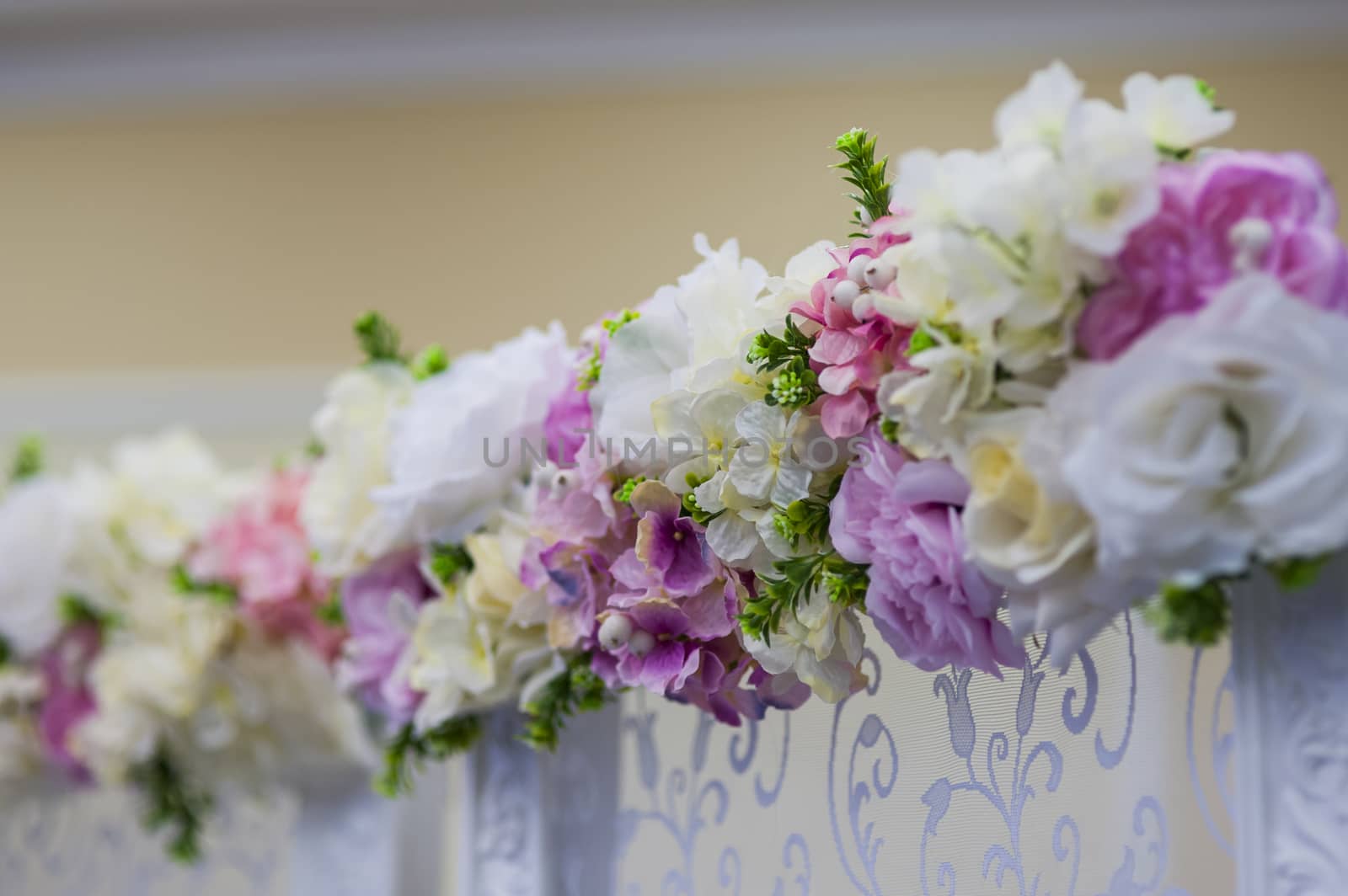 Wedding flowers decoration in the restaurant with white flowers.