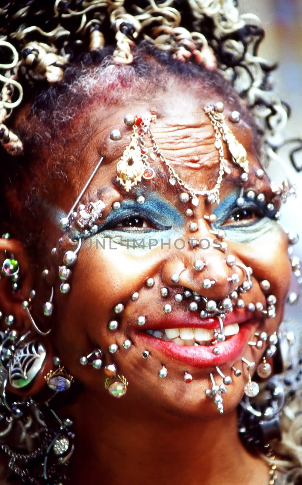 Elaine davidson holds the world record for the most face and body piercings.