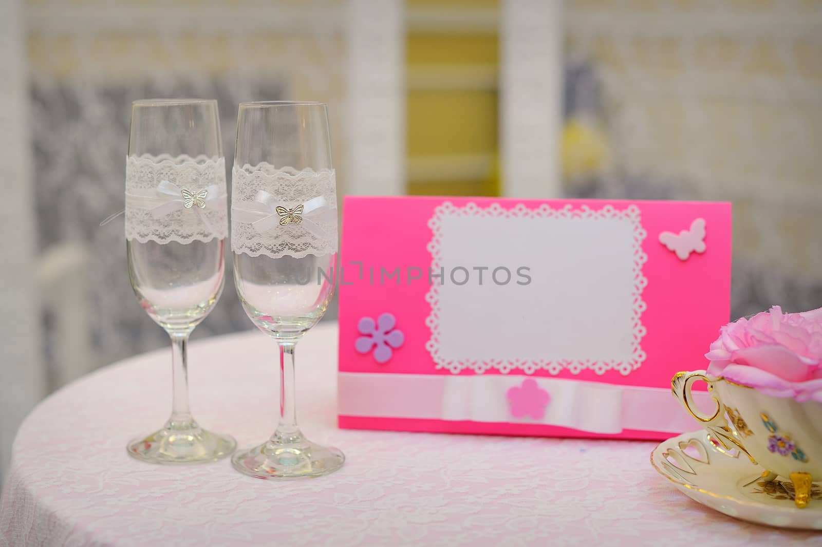 Pair of wedding wineglasses on the table.