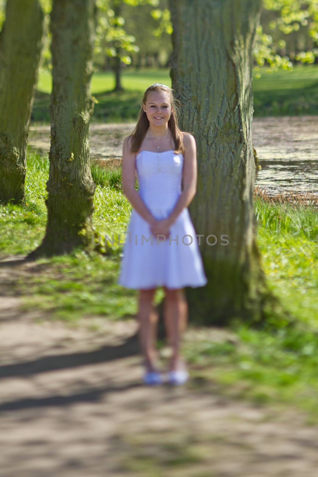 Girl the day of the confirmation in spring in denmark. Shot with a tilt and shift lense
