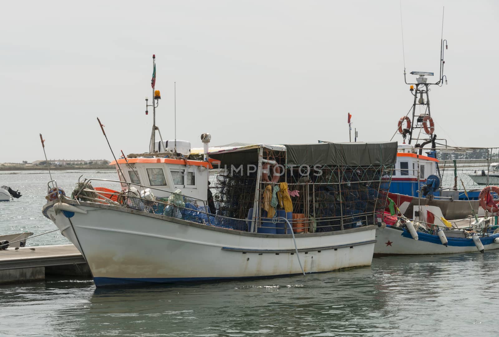 fishing boats in the water between tavira and ria formosa in Portugal Algarve Area