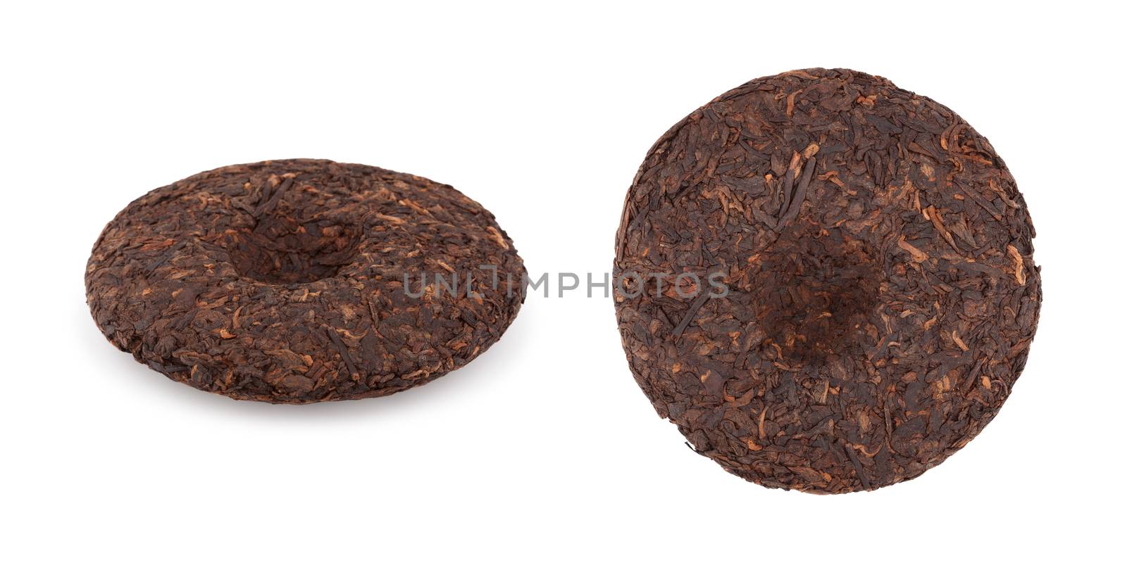 A disc of pressed puer tea on white background, side and top view