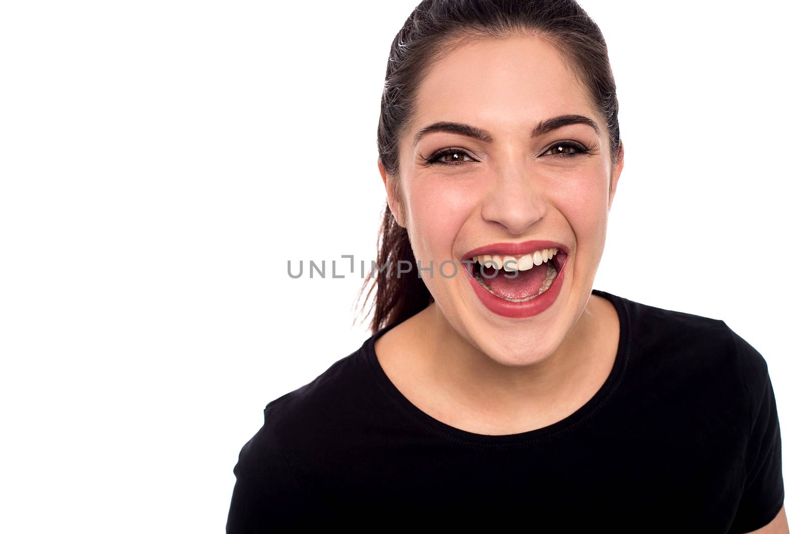 Cheerful woman looking at camera over white