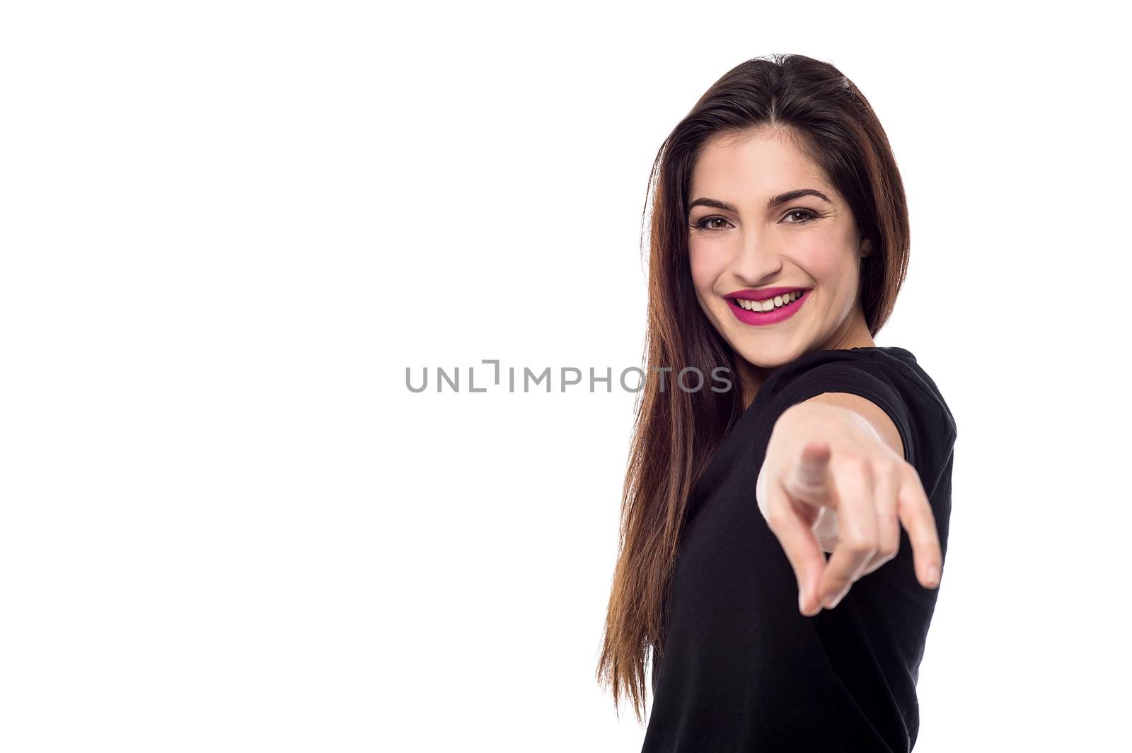 Happy woman pointing her finger at camera