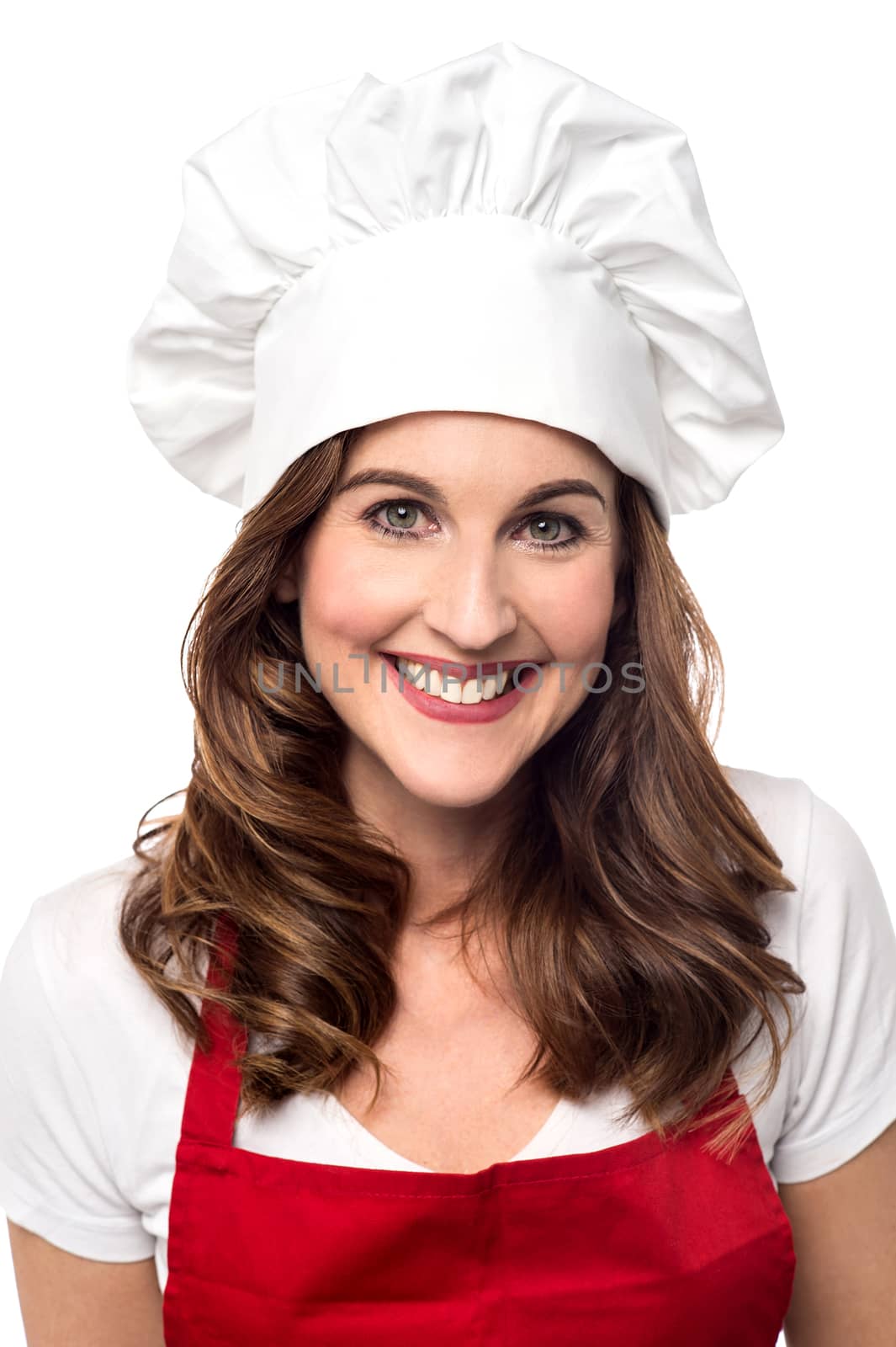 Smiling female chef isolated over white