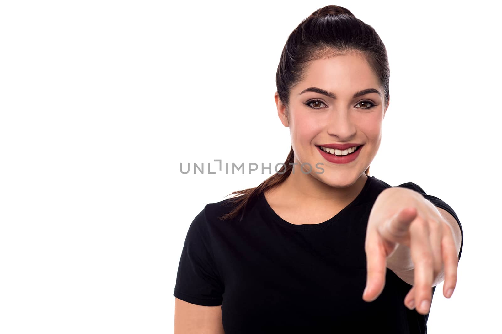 Attractive woman pointing towards camera