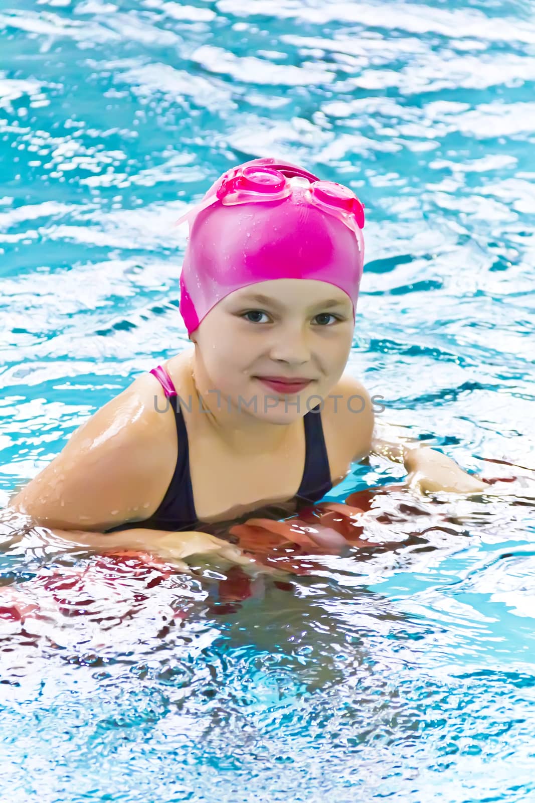 Photo of cute girl in swimming pool