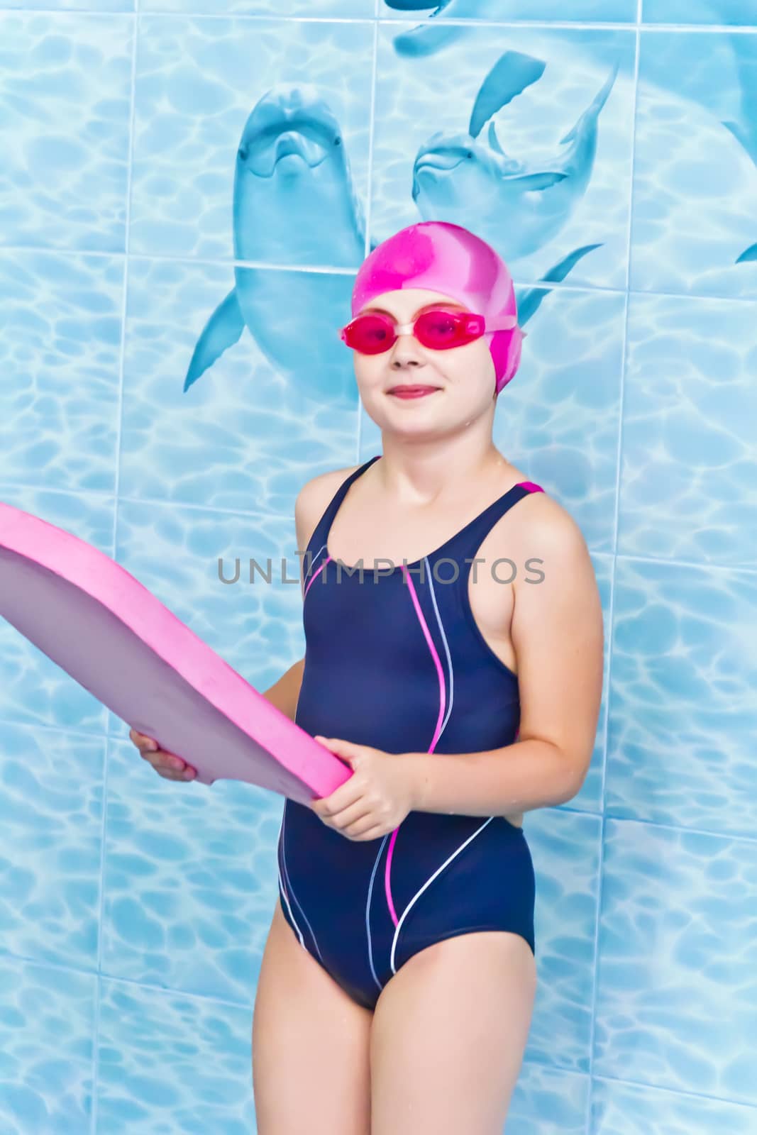 Photo of cute girl in swimming pool
