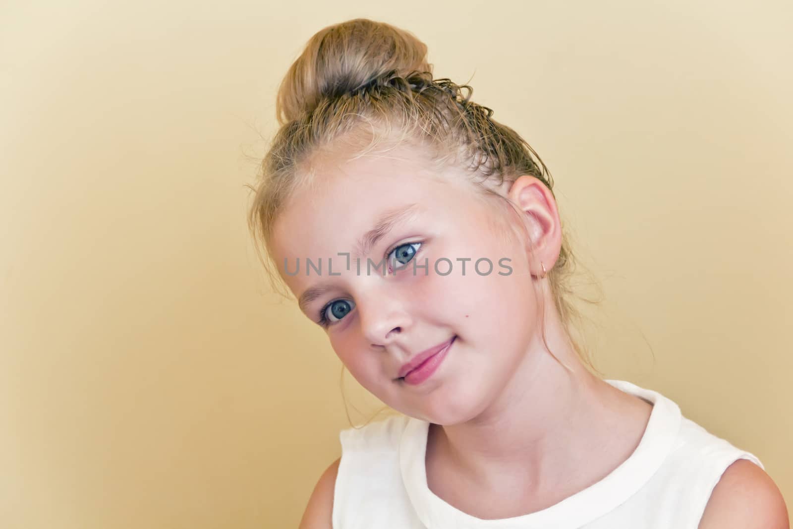 Cute girl with blond long hair and blue eyes