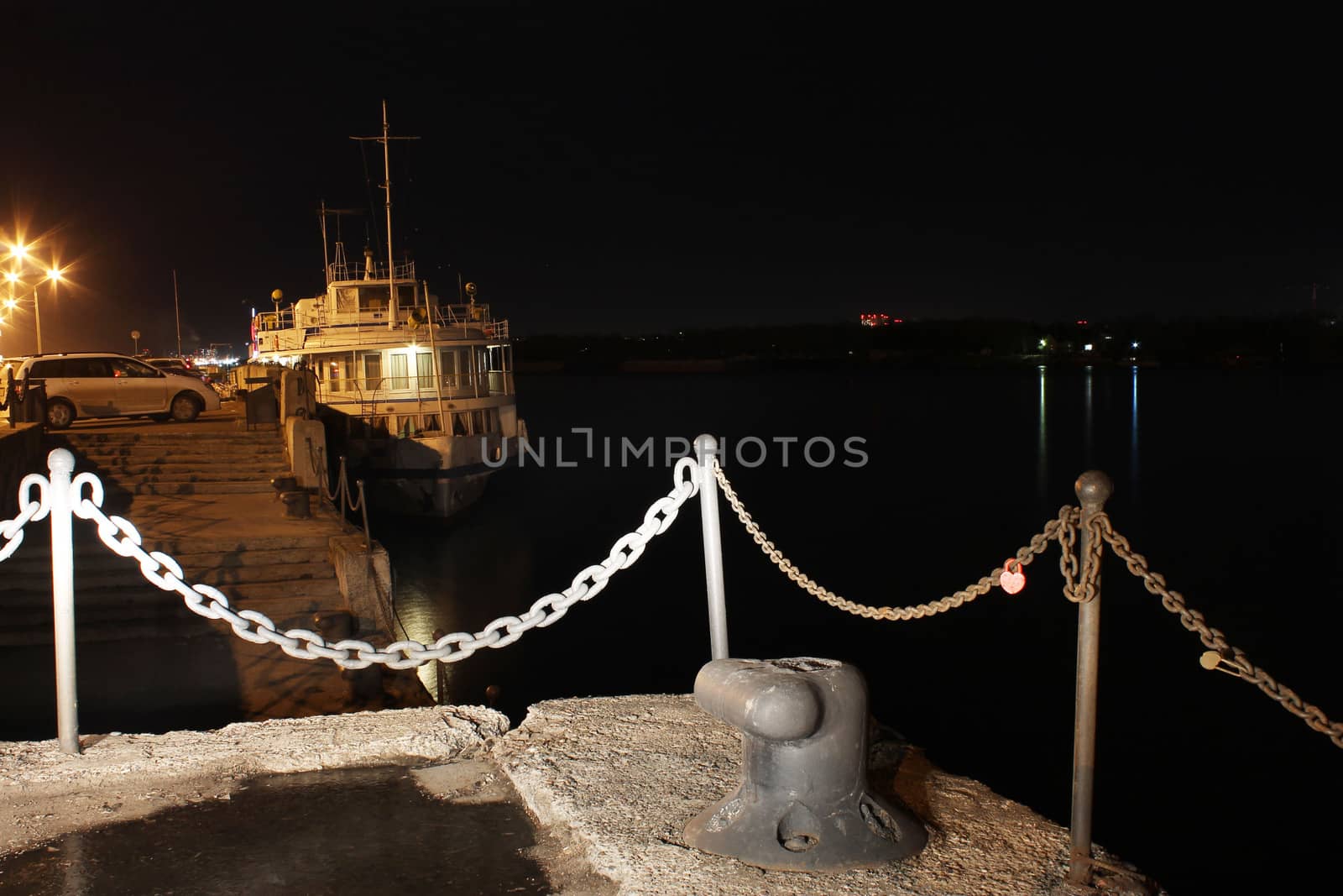 Motor ship standing on the river at night
