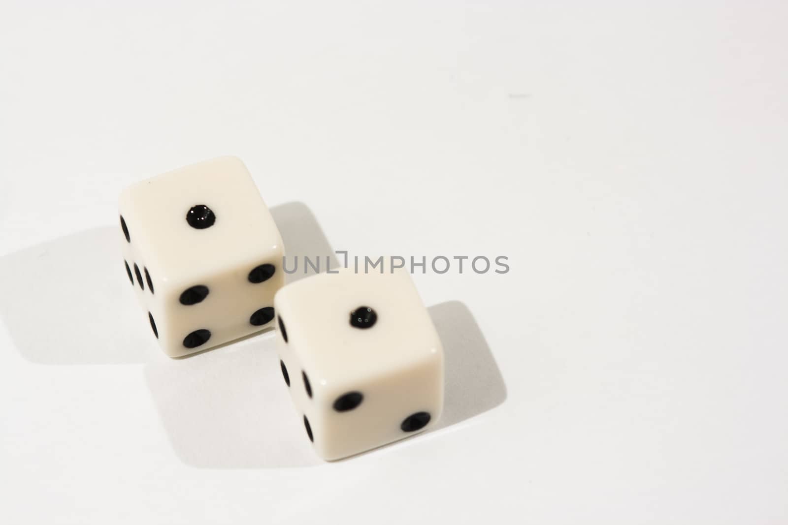 White dice shot against a white background