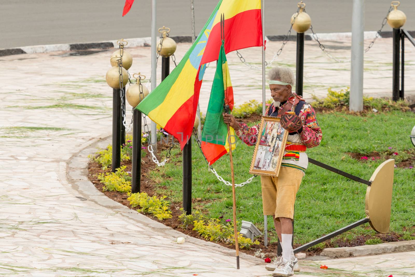 Addis Ababa - May 5: Arbegna, a patriot and war veteran, holds the Ethiopian flag at the 74th anniversary of Patriots' Victory day commemorating the defeat of the invading Italians on May 5, 2015 in Addis Ababa, Ethiopia.