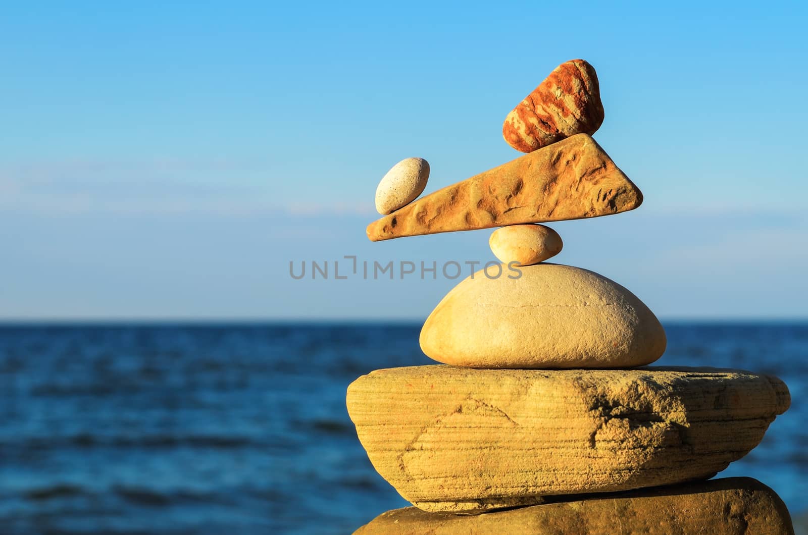 Balancing of stones each other on the seashore