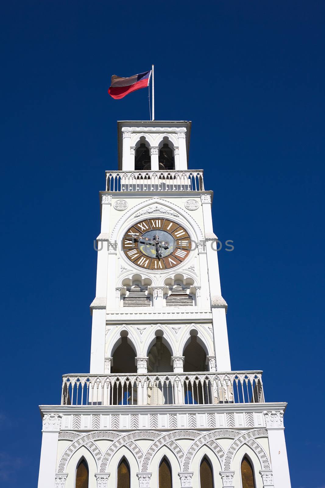 IQUIQUE, CHILE - JANUARY 22, 2015: The Torre Reloj (clock tower) from the year 1877 on Plaza Prat main square on January 22, 2015 in Iquique, Chile. Iquique is a free port city in Northern Chile. 