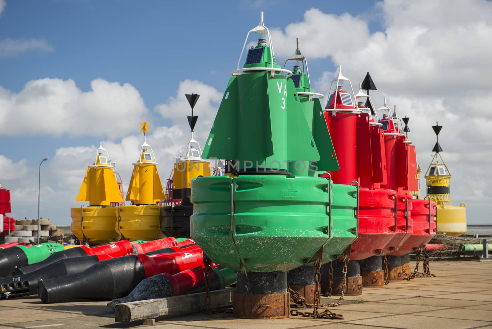 Colored navigation buoys by Tofotografie