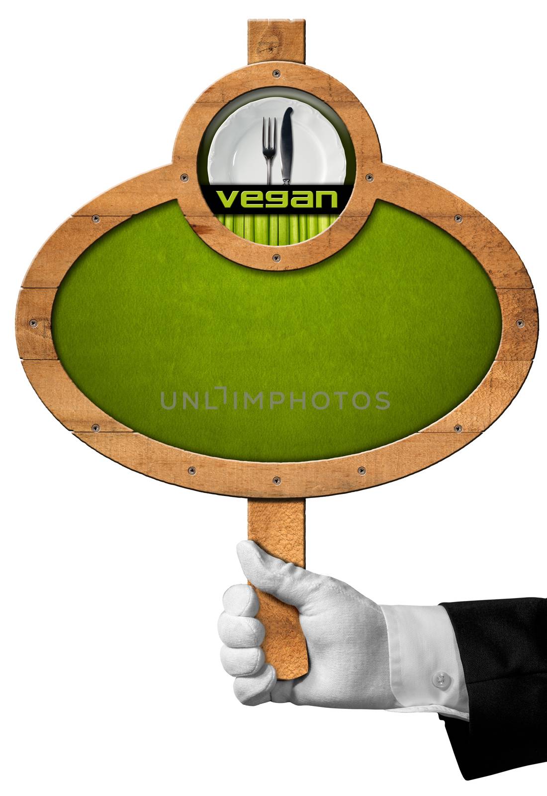 Hand of waiter with white glove holding a wooden pole with an oval sign with wooden frame, vegan symbol with empty white plate and silver cutlery. Isolated on white background