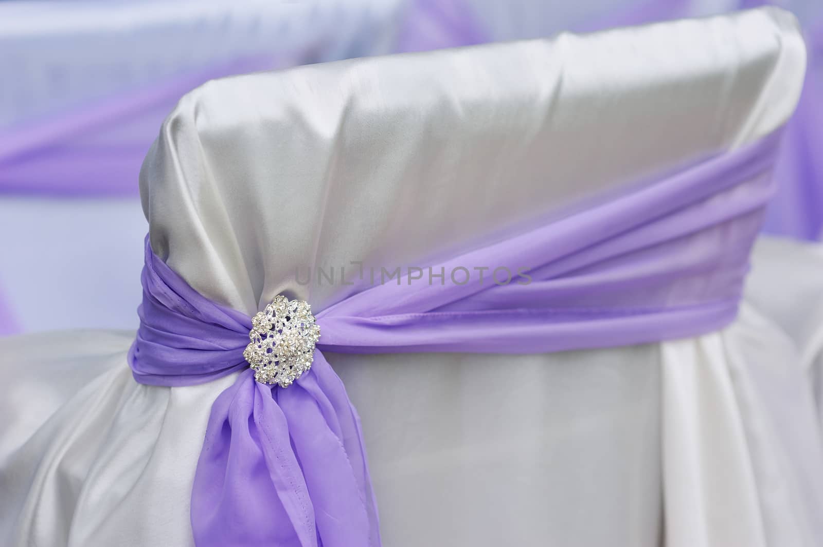 decoration chair purple bow brooch close up
