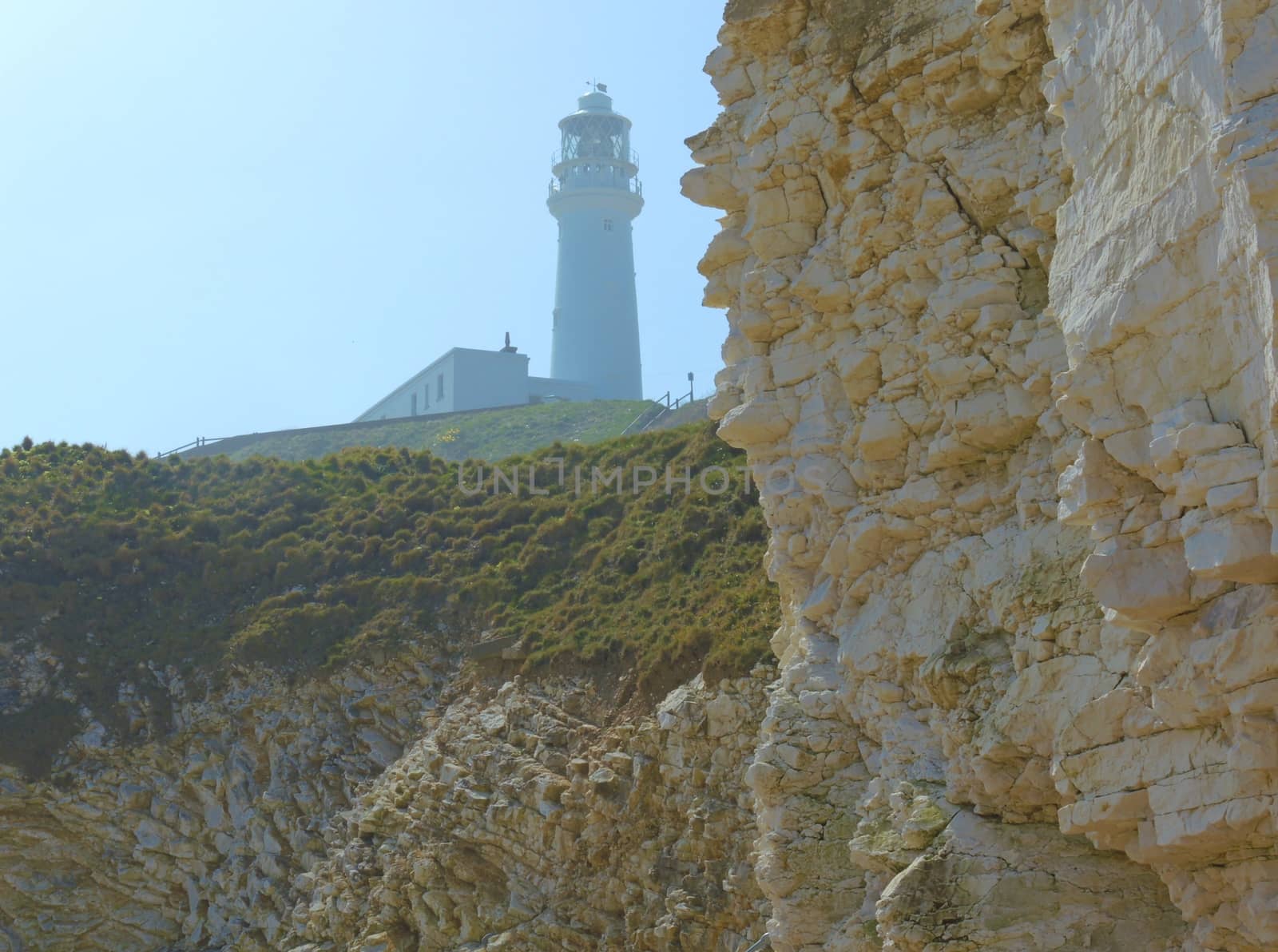 An image from a beach at Flamborough Head, showing the Lighthouse in the background.