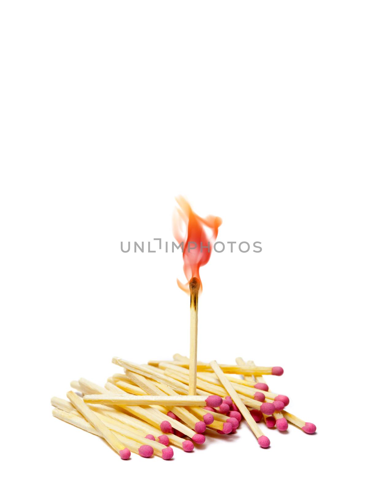 A lot of matches on white isolated background. A match is lit.