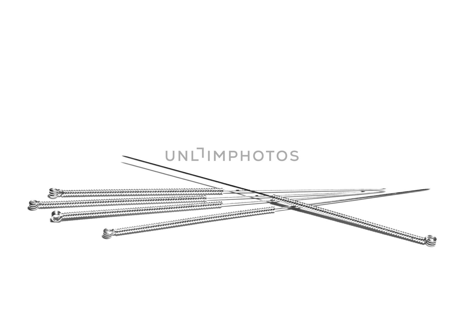 Acupuncture needles on an isolated white background.