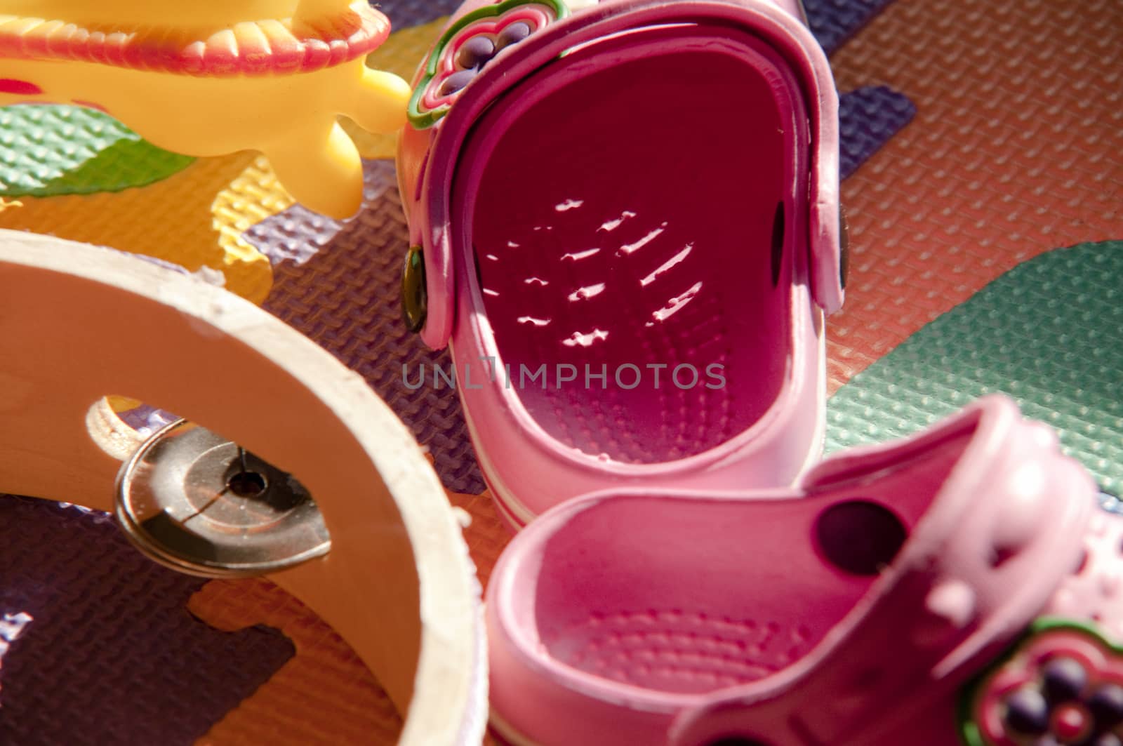 carpet colorful children with above small summer shoes and toys