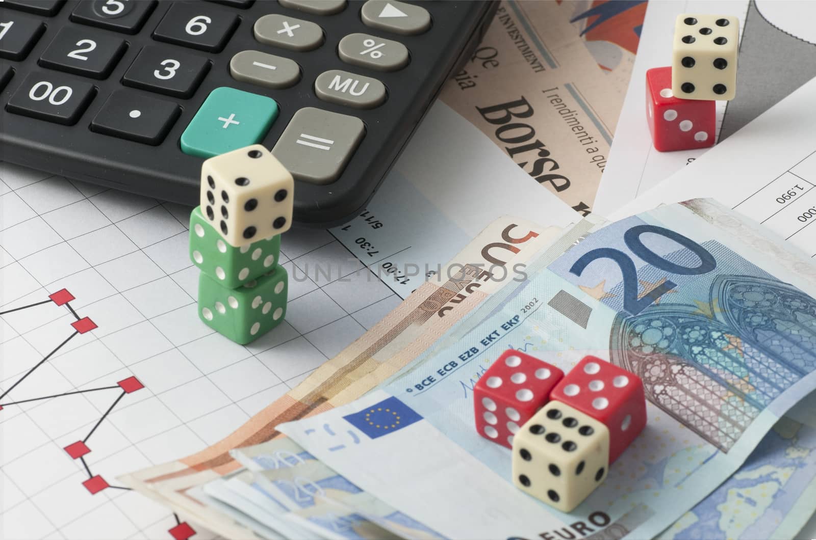 This is a view with the dice game and the game in play the stock market with finance graphs, coins and banknotes