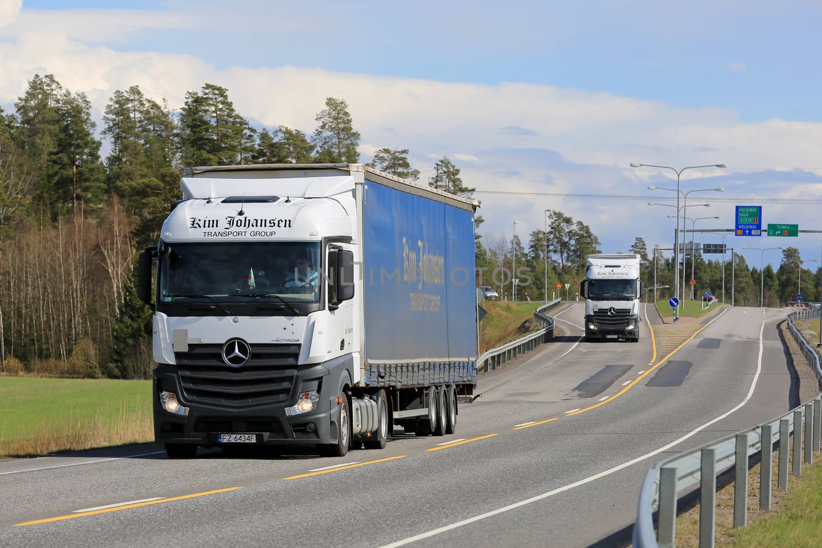 Two Mercedes-Benz Actros Trucks on the Road by Tainas