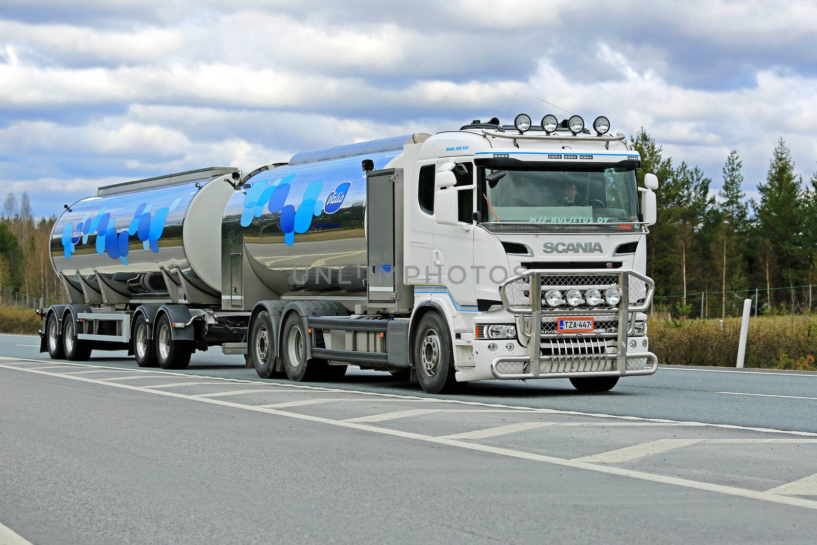 SALO, FINLAND - MAY 2, 2015: New Scania R500 tank truck transports Valio milk along motorway. The usual temperature of transported milk is 3 degrees Celsius.