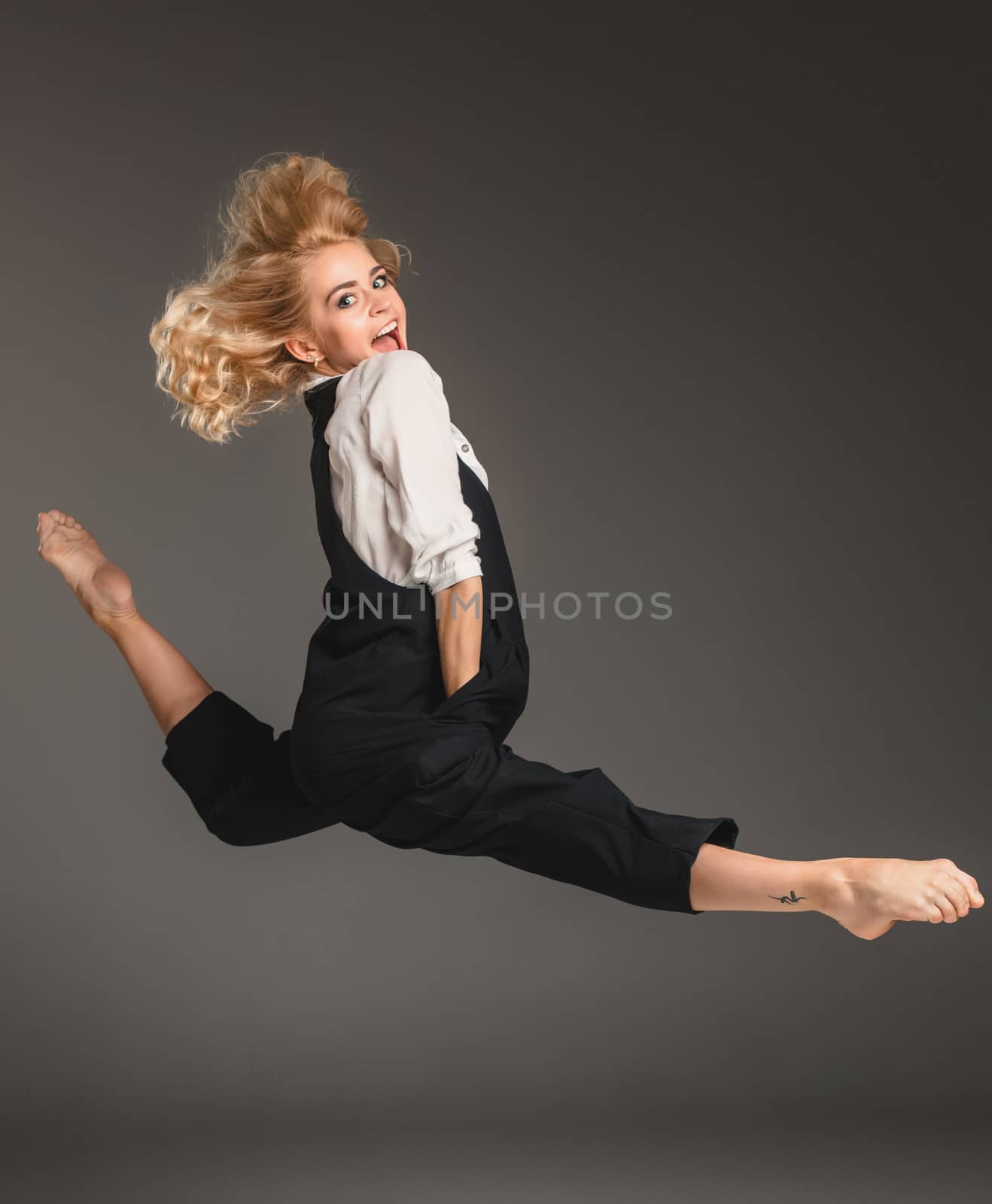 Beauty blond woman in ballet jump by master1305