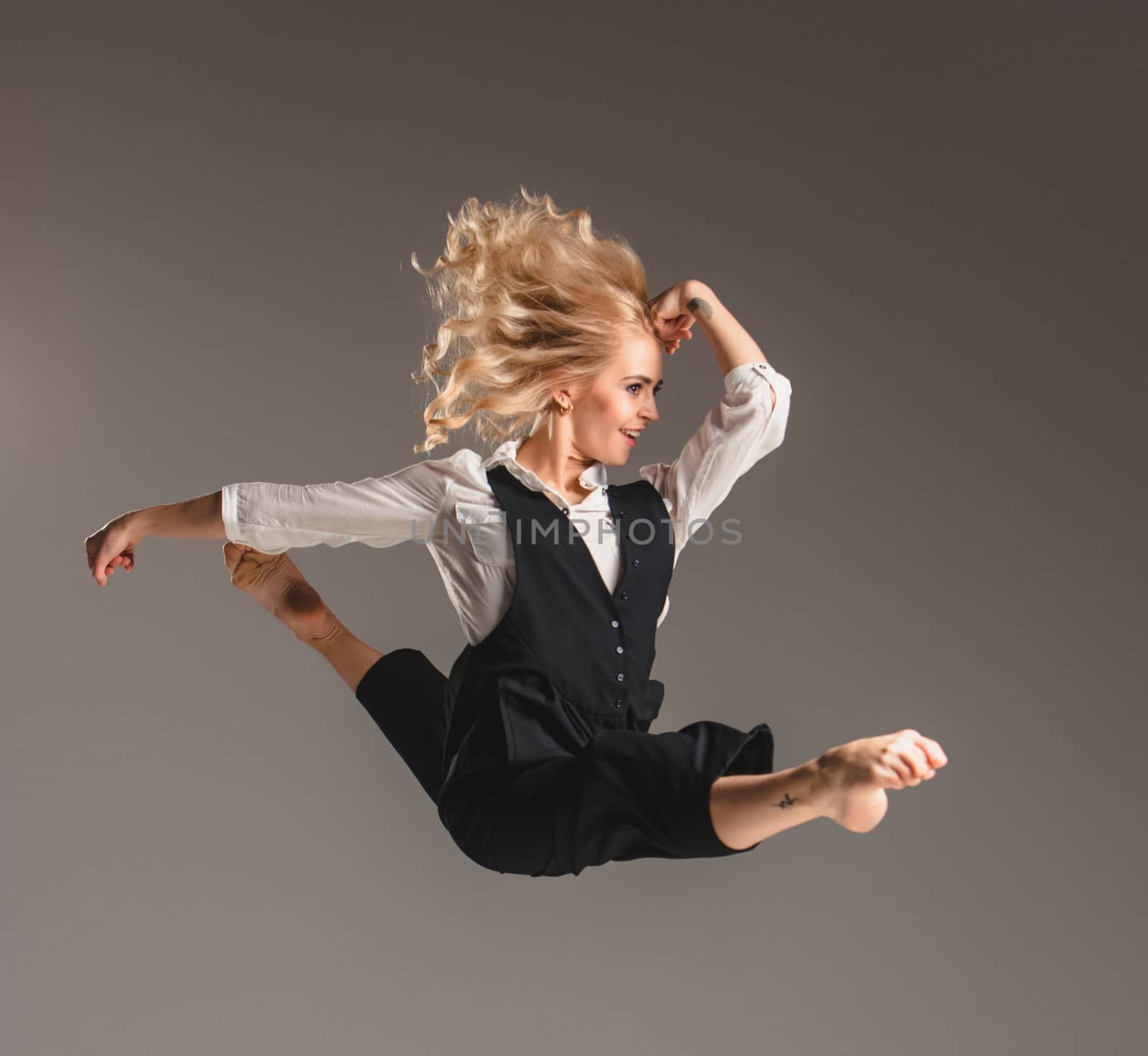Beauty blond woman in ballet jump by master1305