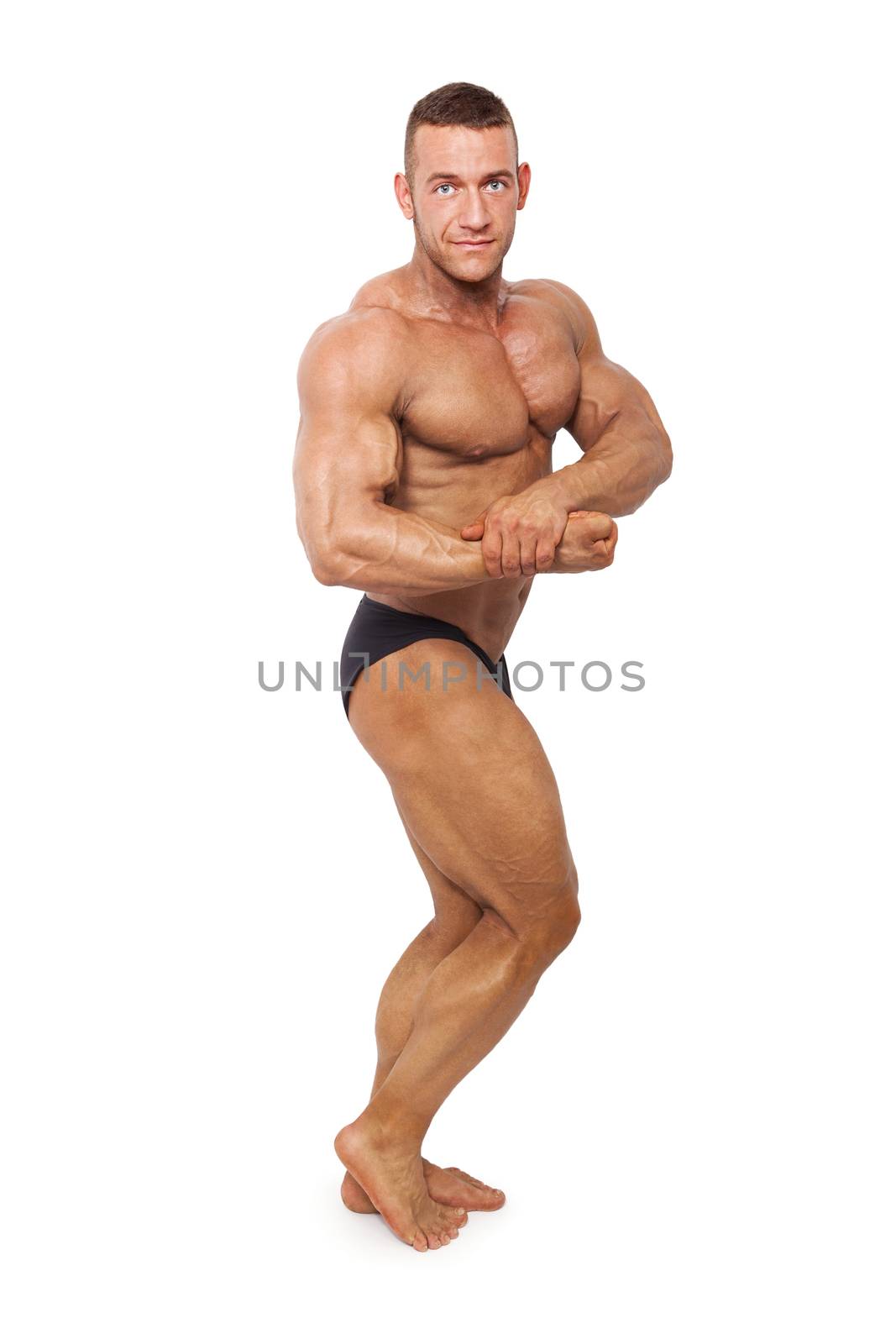 Sexy shirtless muscular bodybuilder posing isolated on white background. Sports and fitness.