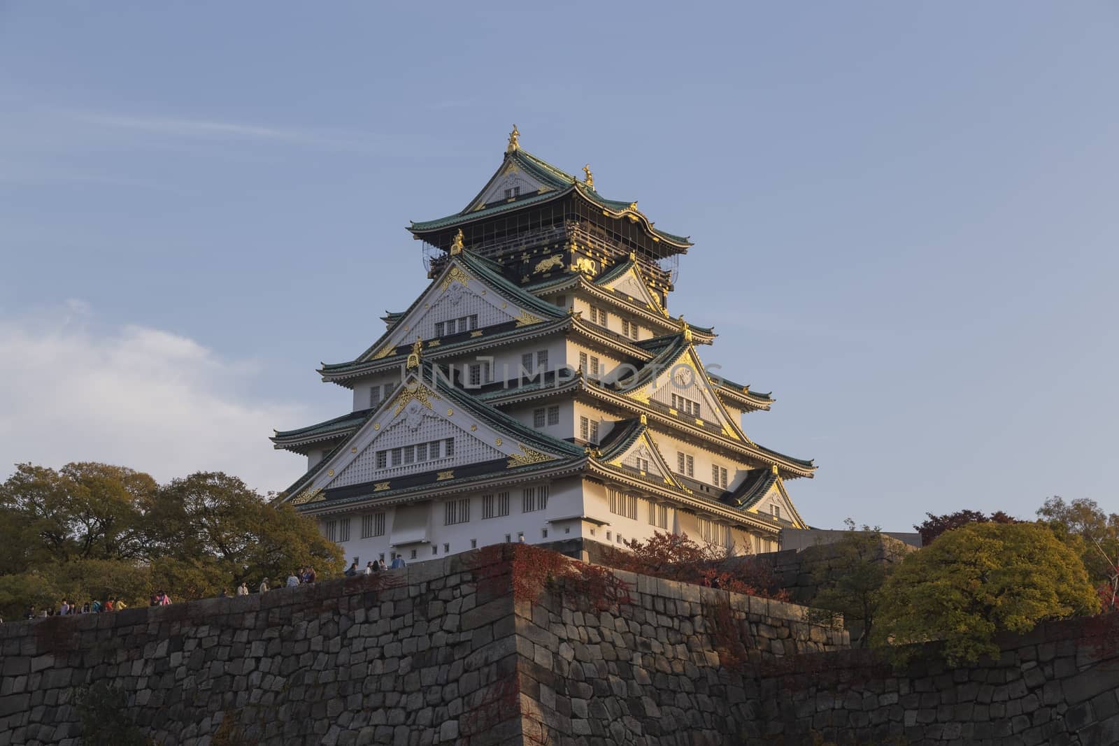 This photo was shot from Osaka Castle, Japan in the evening. The soft sunlight touch the castle is so beautiful.