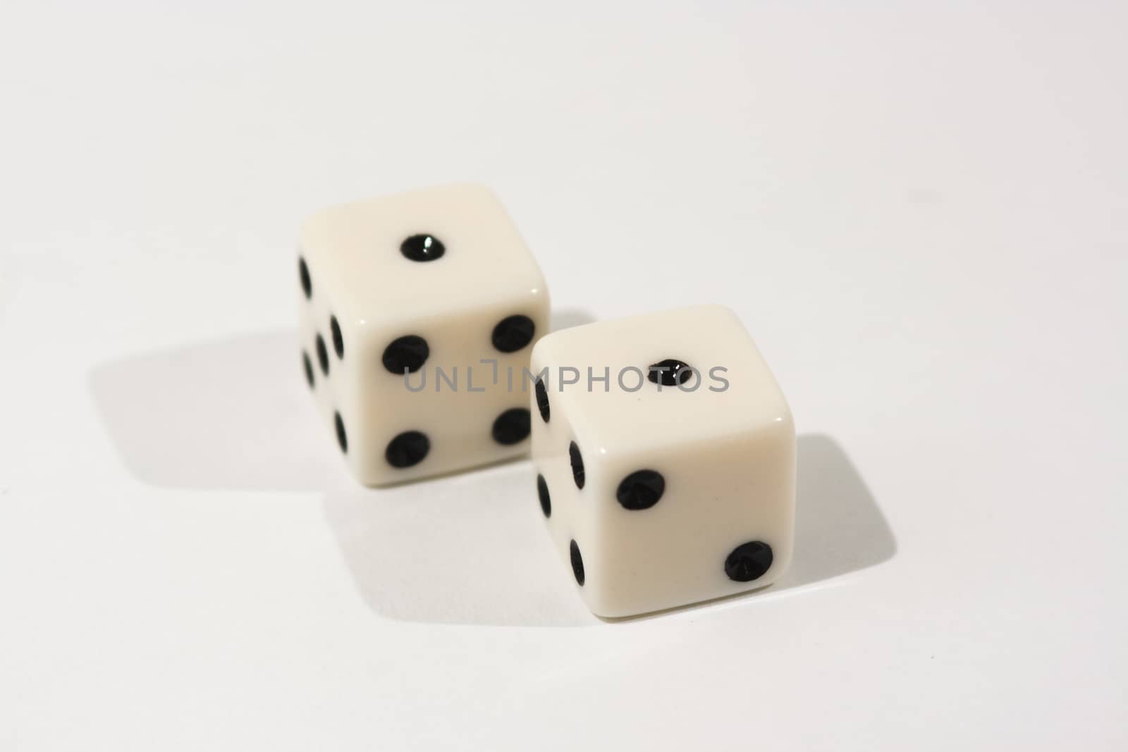 White dice shot against a white background