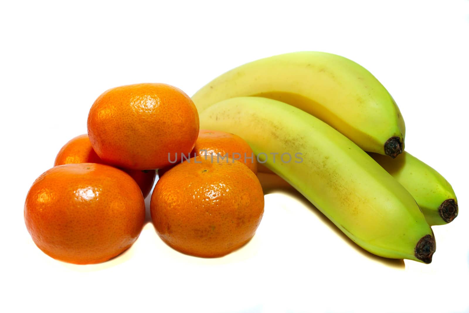 Tangerines and bananas on a white background by LenoraA
