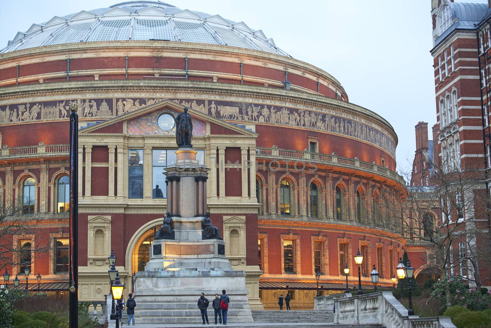LONDON, UK - MARCH 16: Pedestrians on the steps of South porch at the Royal Albert Hall. March 16, 2015 in London. The concert hall is home to the Proms, which take place each summer since 1941.