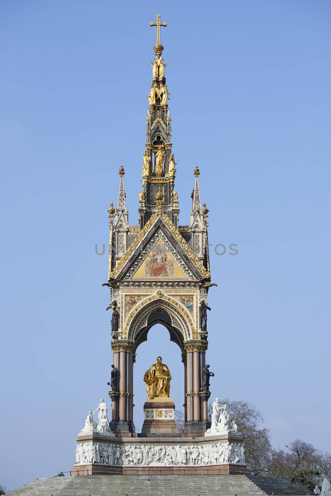 The Albert Memorial in sunny day, in Kensington Gardens, London. The monument was commissioned by Queen Victoria in memory of her husband, who died in 1861.