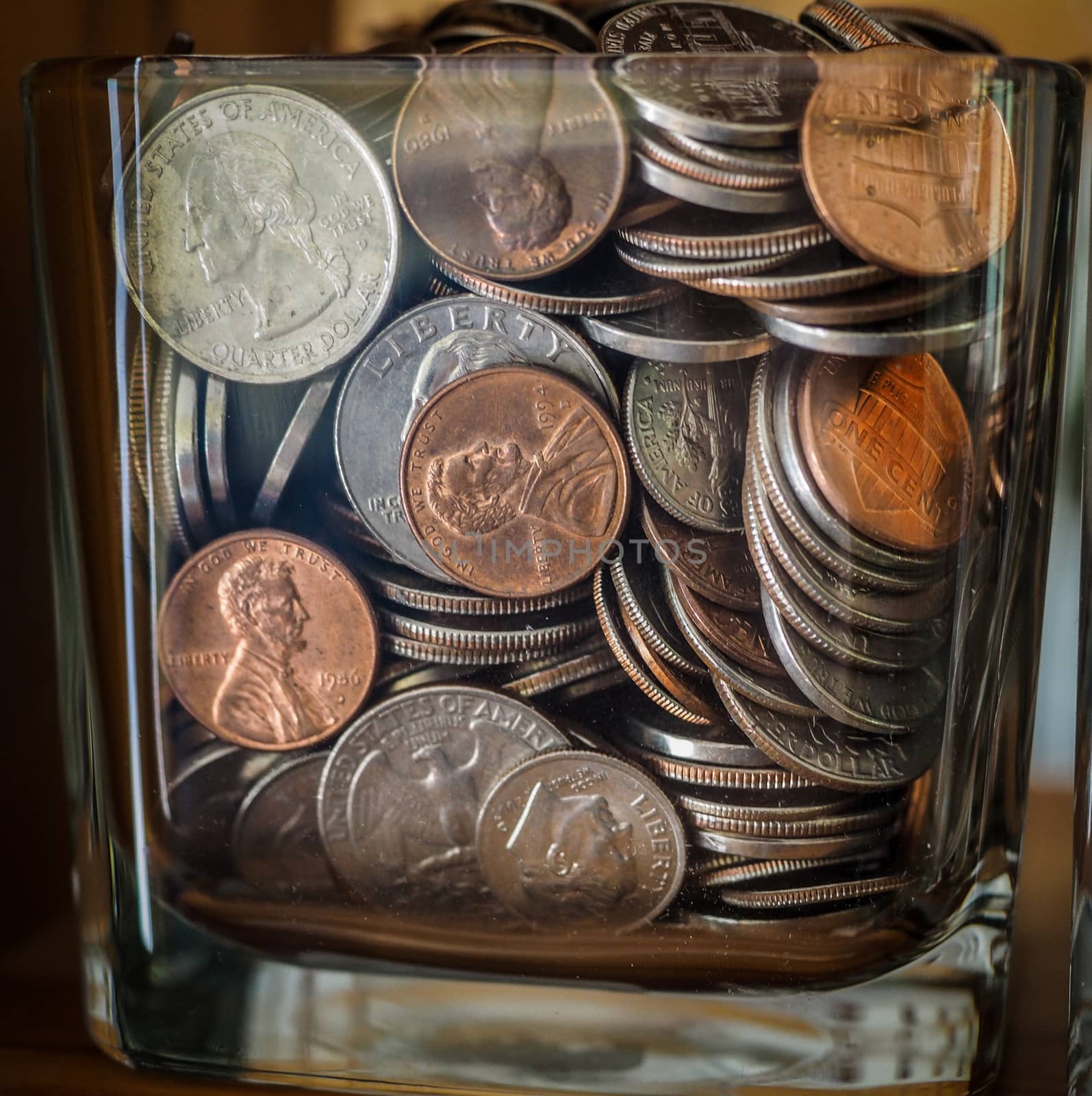 Savings Jar Full Of Money and US Coins