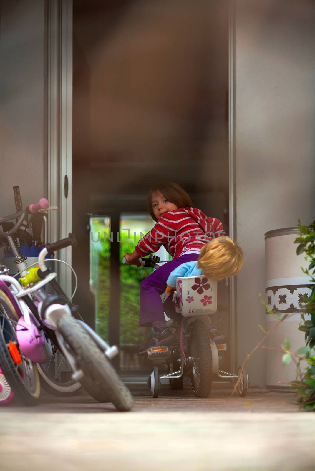 View of Child playing with the bike