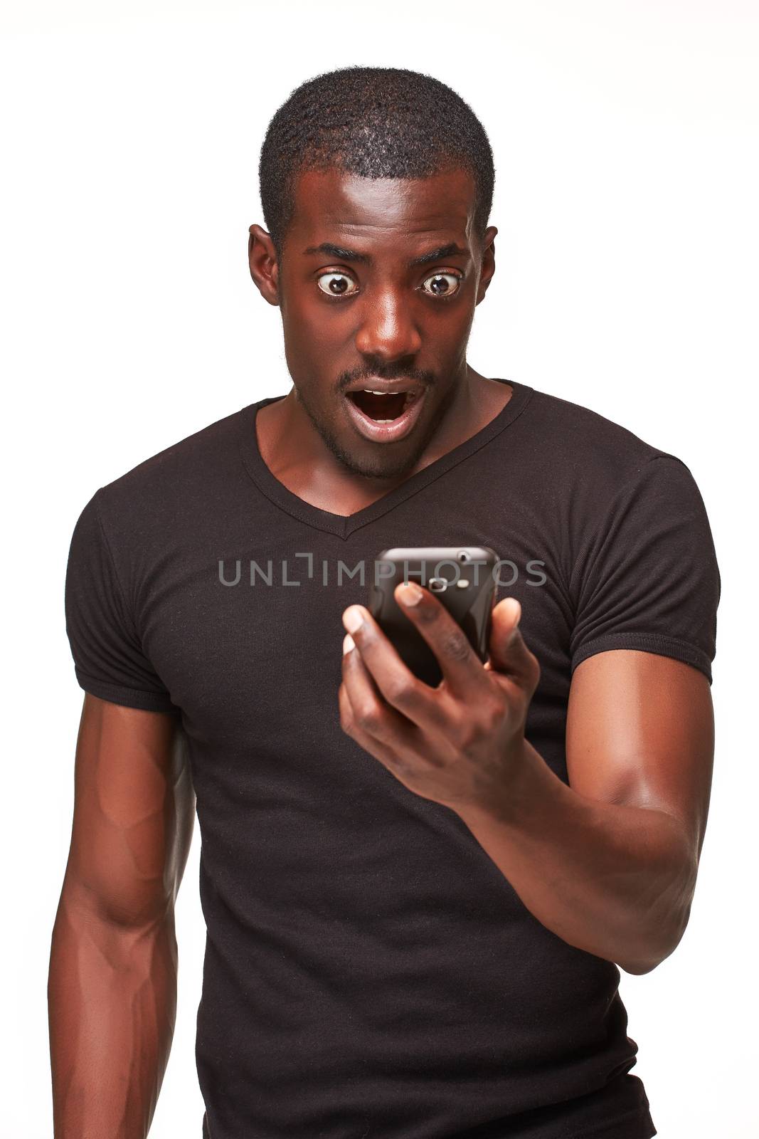 Portrait of surprised african man talking on the phone isolated on a white background