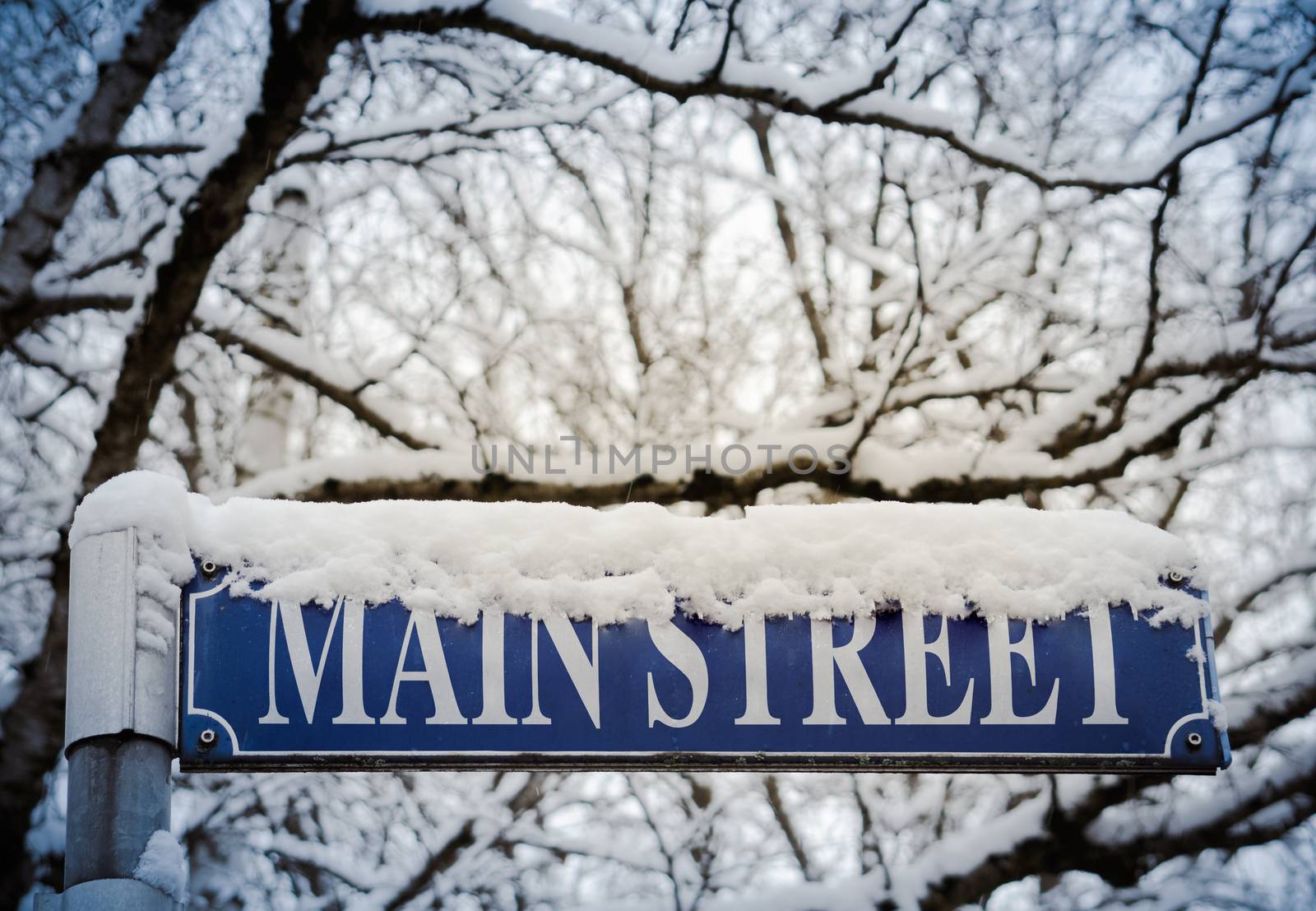 Retro Style Image Of Snow On A Sign For Main Street