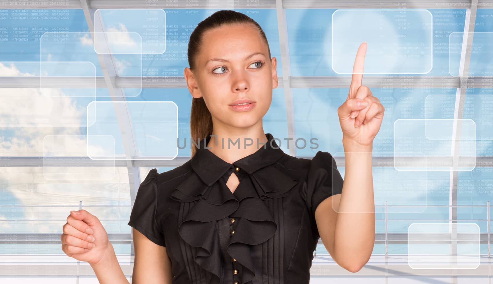 Young businesswoman pressing on holographic screen by cherezoff