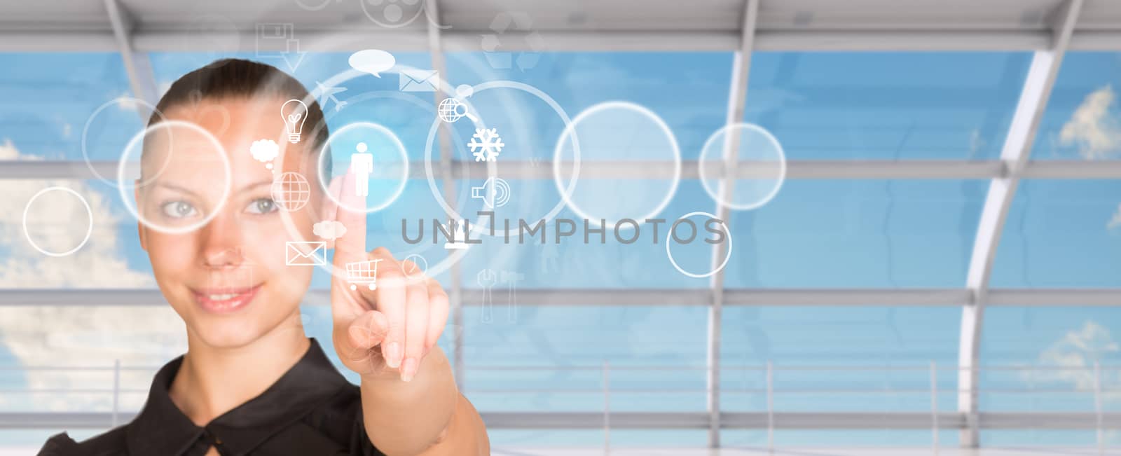 Young businesswoman in dress pressing on holographic screen with icons, close-up view