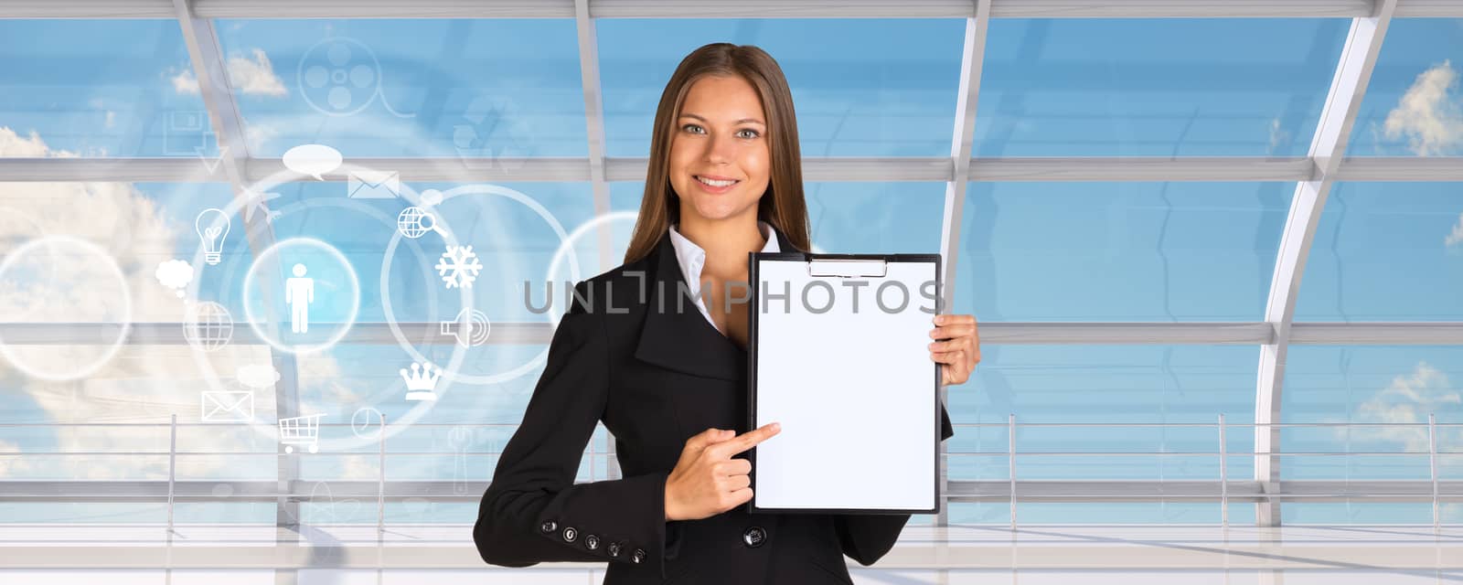 Young businesswoman in black suit with folder and blank paper with icons on window blue sky background