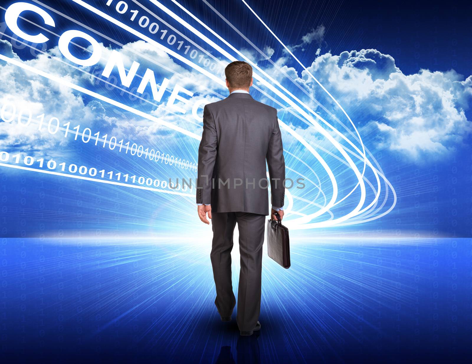 Rear view of businessman with suitcase walking on abstract blue background